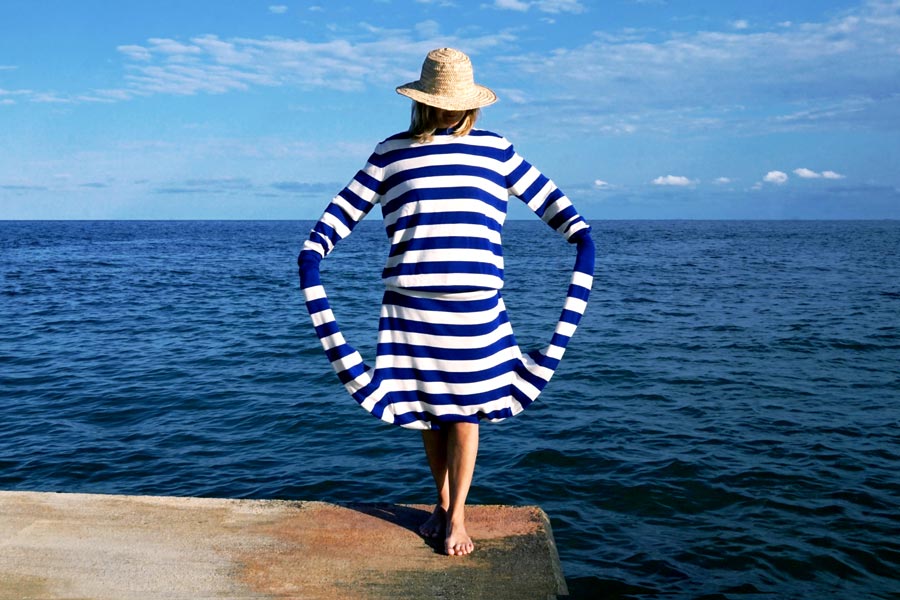 Model with blue-striped sailor jersey posing on the back
